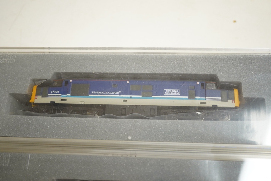 Three boxed Graham Farish N gauge railway Class 37/4 Co-Co diesel-electric locomotives; a Scottish EWS, Loch Awe (371151), a Regional Railways, Eisteddfod Genedlaethol 37429 (371154), and an EWS, 37419 (371153).